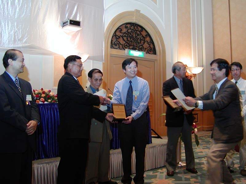 One of the awardees receiving his award from Dr. Cal, EASTS President